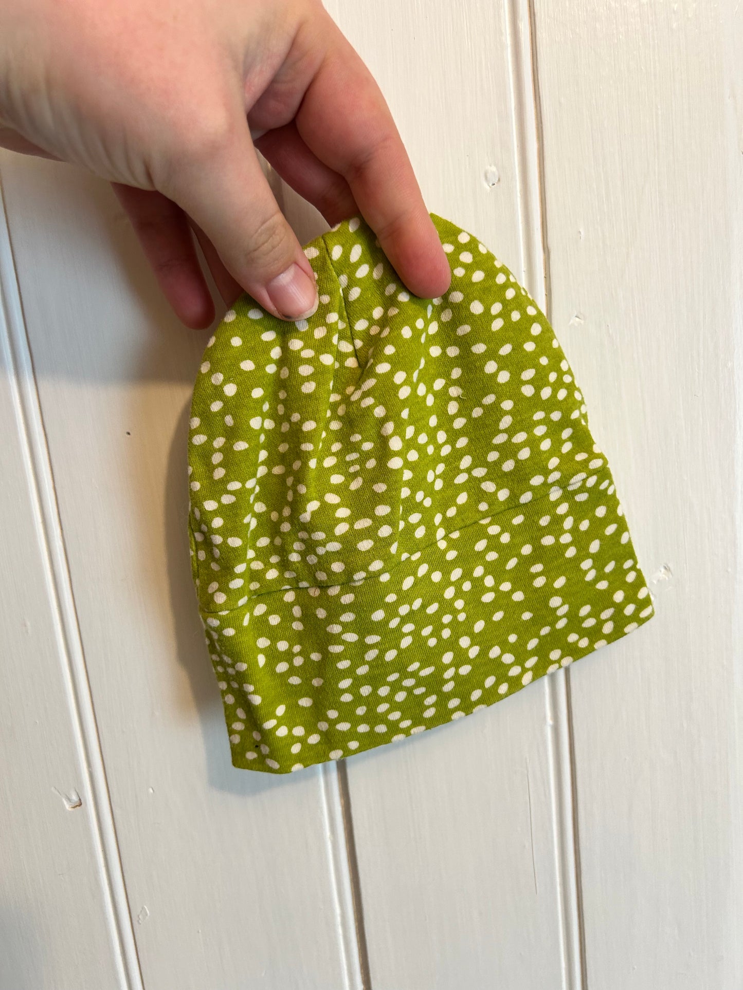 Green polka dot infant hat