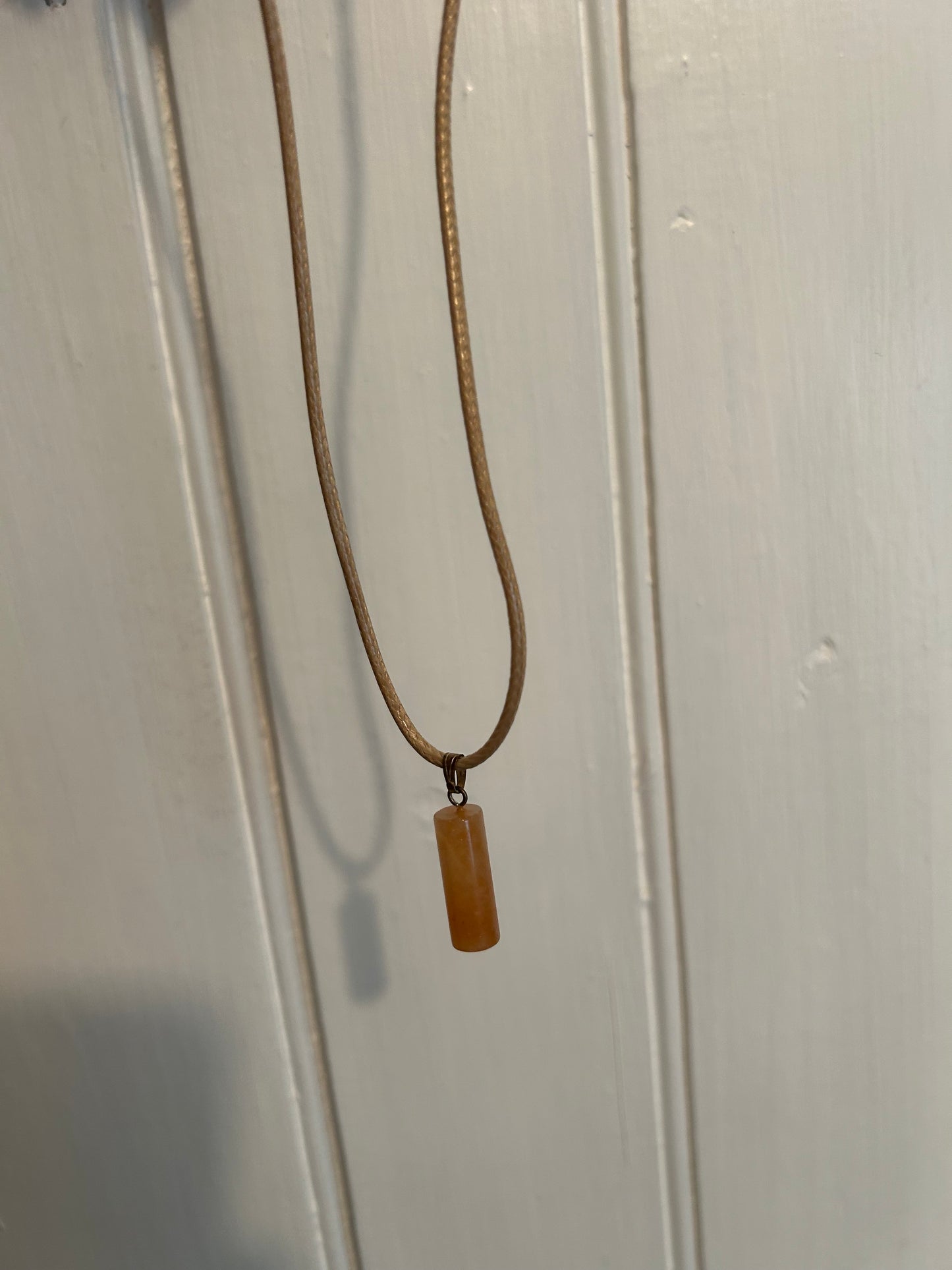 Handmade tan cylindrical gemstone pendant necklace