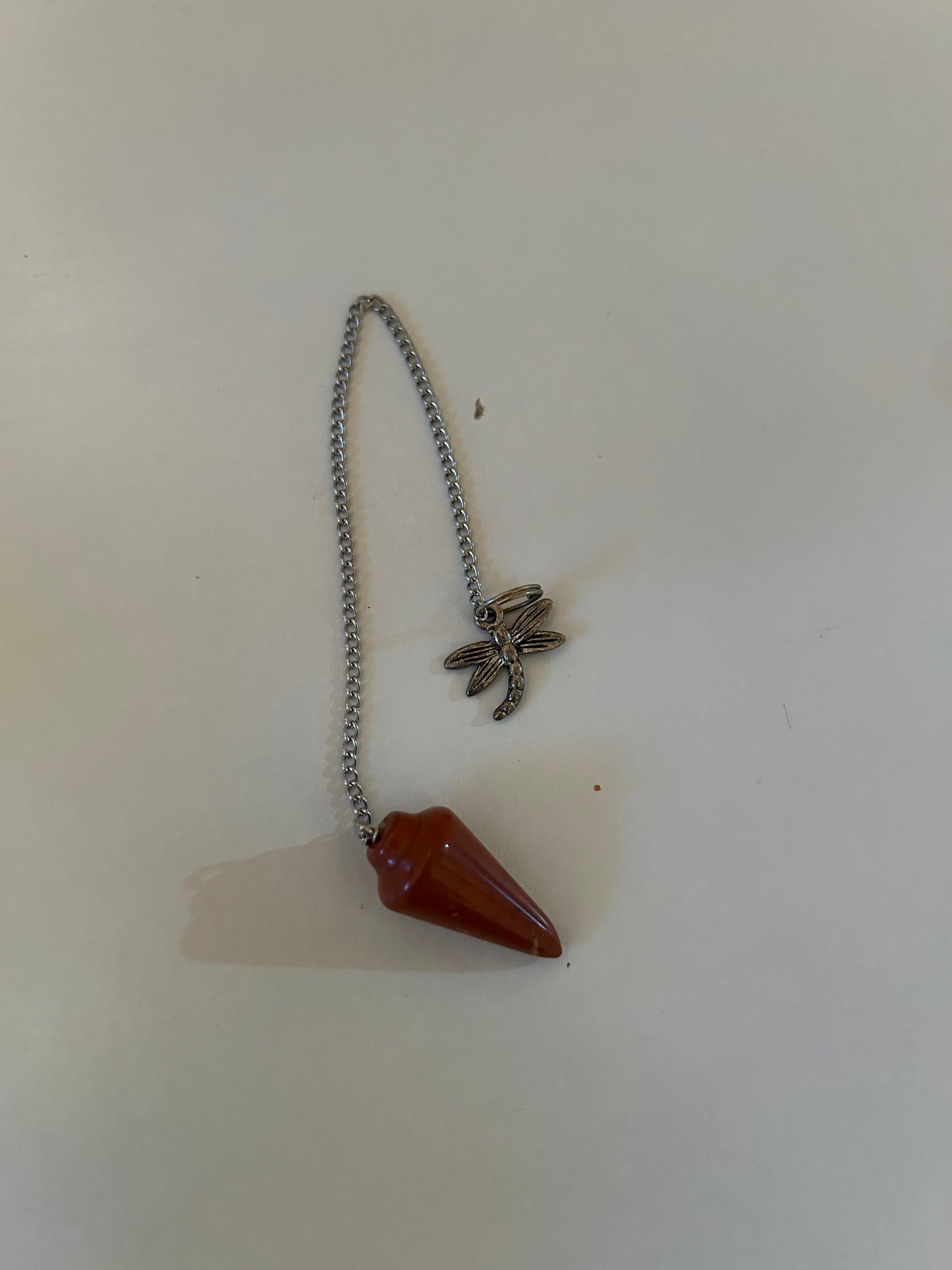 Orange dragonfly pendulum