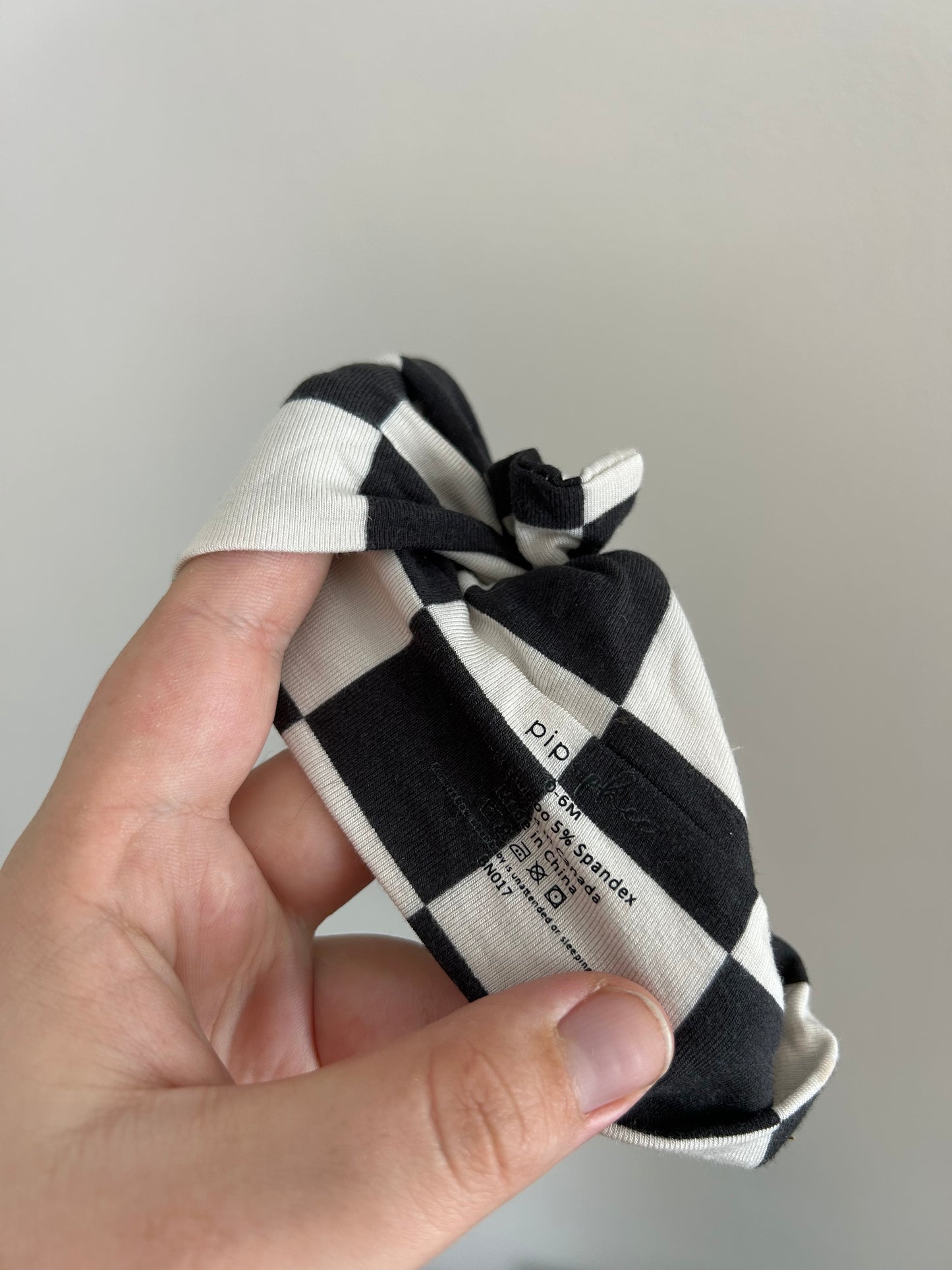Pip & phee 0/6m white & black checkered bow