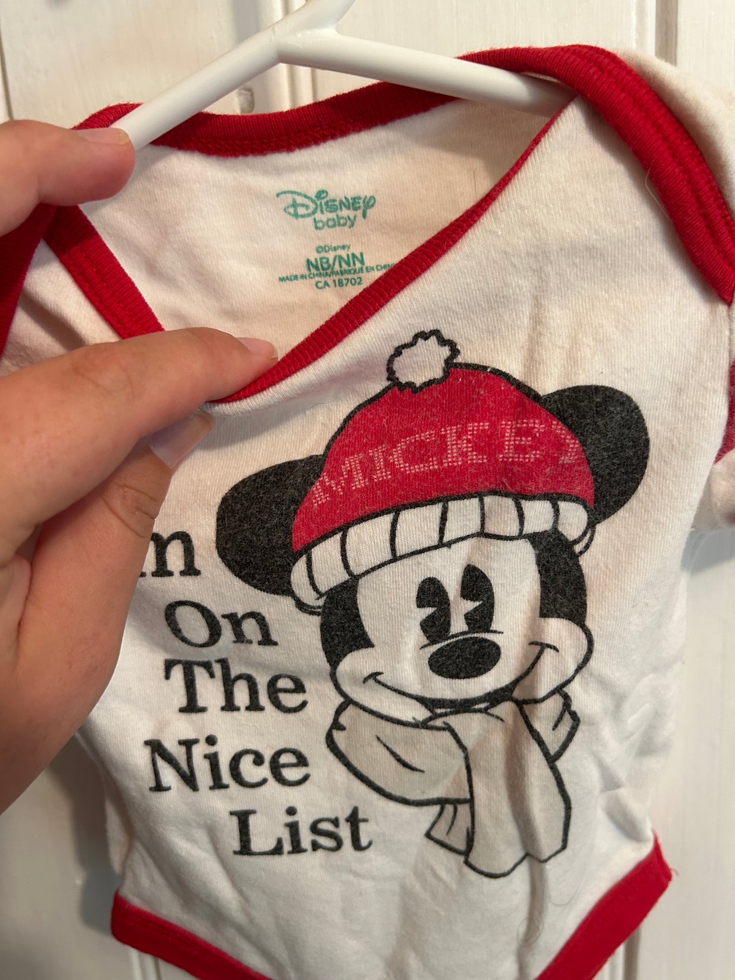 Disney newborn red nice list onesie