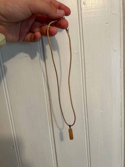 Handmade tan cylindrical gemstone pendant necklace